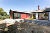 Modern home with Trees, Shrubs, Wood Patio, Porch, Deck, Large Patio, Porch, Deck, Back Yard, Decking Patio, Porch, Deck, Doors, Sliding Door Type, Exterior, and Metal. Rear yard with raised deck and continuous circuit of sliding doors for indoor access to bedroom, living room and dining room beyond Photo 4 of Allaseba Residence