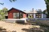Modern home with Back Yard, Large Patio, Porch, Deck, Wood Patio, Porch, Deck, Trees, Decking Patio, Porch, Deck, Doors, Exterior, Metal, and Sliding Door Type. Rear yard elevation with raised deck and continuous circuit of sliding doors for indoor access Photo of Allaseba Residence