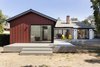 Modern home with Back Yard, Trees, Large Patio, Porch, Deck, Decking Patio, Porch, Deck, Wood Patio, Porch, Deck, Doors, Exterior, Metal, and Sliding Door Type. Rear yard elevation with raised deck and continuous circuit of sliding doors for indoor access Photo 2 of Allaseba Residence