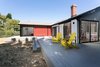 Modern home with Back Yard, Shrubs, Wood Patio, Porch, Deck, Trees, Large Patio, Porch, Deck, Decking Patio, Porch, Deck, Doors, Exterior, Sliding Door Type, and Metal. Rear yard with raised deck and continuous circuit of sliding doors for indoor access to bedroom, living room and dining room beyond Photo 5 of Allaseba Residence