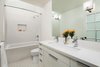 Modern home with Bath Room, Engineered Quartz Counter, Undermount Sink, Ceramic Tile Floor, Undermount Tub, Open Shower, Recessed Lighting, Ceramic Tile Wall, Two Piece Toilet, and Wall Lighting. KId's Bathroom with skylight Photo 12 of Bowling Green Residence