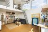 Modern home with Study Room Type, Craft Room Room Type, Sun Room Room Type, Living Room Room Type, Den Room Type, Chair, Bookcase, Storage, Shelves, Desk, Cork Floor, Sofa, Coffee Tables, Recessed Lighting, Track Lighting, Windows, Picture Window Type, and Metal. View of book loft mezzanine with views to the east Photo 7 of Mar Vista Art Studio