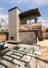 Modern home with Desert, Trees, Walkways, Hardscapes, Back Yard, Concrete Patio, Porch, Deck, Wood Patio, Porch, Deck, Pavers Patio, Porch, Deck, Small Patio, Porch, Deck, Decking Patio, Porch, Deck, Horizontal Fences, Wall, Decomposed Granite Patio, Porch, Deck, Wood Fences, Wall, Hanging Lighting, Exterior, Metal, Sliding Door Type, Picture Window Type, Sliding Window Type, and Living Room. View from the existing main house of the hardscape leading to the art studio and deck. The exterior stair has open risers Photo 8 of Mar Vista Art Studio