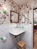 Modern home with Marble Floor, Wall Mount Sink, Subway Tile Wall, and Bath Room. Kid's Bathroom with playful wallpaper, subway tile and colorful bathroom accessories Photo 7 of Ashland Residence
