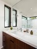 Modern home with Marble Counter, Undermount Sink, Undermount Tub, Recessed Lighting, Marble Wall, Metal, Casement Window Type, and Bath Room. Bathroom vanity with American Black Walnut cabinets Photo 10 of Ashland Residence