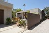 Modern home with Back Yard, Trees, Hardscapes, Side Yard, Walkways, Shrubs, Decomposed Granite Patio, Porch, Deck, Concrete Patio, Porch, Deck, Horizontal Fences, Wall, Wood Fences, Wall, Landscape Lighting, Exterior, Metal, Windows, Sliding Door Type, and Awning Window Type. From driveway vehicular gate with space between garage and house creating an outdoor dining room and seating at the firepit (bedroom beyond) Photo 13 of Ashland Residence