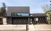 Modern home with Exterior, House Building Type, Green Roof Material, Stucco Siding Material, and Flat RoofLine. Front facade with cantilevered pergola canopy and shadows Photo 2 of Las Casas Residence