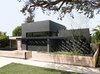 Modern home with Exterior, House Building Type, Green Roof Material, Stucco Siding Material, and Flat RoofLine. Front yard Photo of Las Casas Residence