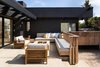 Modern home with Outdoor, Front Yard, Side Yard, Shrubs, Hardscapes, Wood Patio, Porch, Deck, Small Patio, Porch, Deck, Decomposed Granite Patio, Porch, Deck, Concrete Patio, Porch, Deck, and Landscape Lighting. Patio with gas firepit Photo 14 of Las Casas Residence