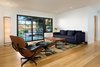 Den with Eames chair overlook backyard Photo 18 of Ridgemont Residence modern home