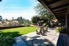 Modern home with Outdoor, Back Yard, Garden, Field, Woodland, Trees, Shrubs, Gardens, Hardscapes, Grass, Flowers, Walkways, Hot Tub Pools, Tubs, Shower, Large Patio, Porch, Deck, Wood Patio, Porch, Deck, Stone Patio, Porch, Deck, Pavers Patio, Porch, Deck, Decking Patio, Porch, Deck, Planters Patio, Porch, Deck, and Horizontal Fences, Wall. Canyon view from outside living room of backyard Photo 10 of Ridgemont Residence