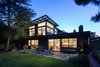 Modern home with Outdoor, Back Yard, Garden, Woodland, Trees, Grass, Hardscapes, Gardens, Flowers, Pavers Patio, Porch, Deck, Stone Patio, Porch, Deck, and Walkways. Backyard at dusk Photo 4 of Ridgemont Residence
