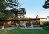 Modern home with Exterior, House Building Type, Mid-Century Building Type, Metal Roof Material, Wood Siding Material, Stucco Siding Material, Ranch Building Type, Shingles Roof Material, and Shed RoofLine. Backyard elevation Photo 8 of Ridgemont Residence