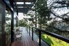 Modern home with Outdoor, Back Yard, Woodland, Trees, Shrubs, Grass, Wood Patio, Porch, Deck, Horizontal Fences, Wall, and Decking Patio, Porch, Deck. Second floor balcony off master suite overlooks canyon Photo 11 of Ridgemont Residence