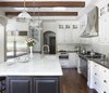 Modern home with Kitchen, Marble Counter, Medium Hardwood Floor, Colorful Cabinet, White Cabinet, Stone Tile Backsplashe, Glass Tile Backsplashe, Pendant Lighting, Recessed Lighting, Refrigerator, Range Hood, Microwave, Range, and Undermount Sink. Kitchen remodel Photo 4 of Rustic elegance