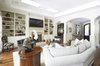 Modern home with Living Room, Chair, Sectional, Ottomans, End Tables, Recessed Lighting, Console Tables, Bookcase, Medium Hardwood Floor, and Gas Burning Fireplace. Great Room Photo 9 of Rustic elegance