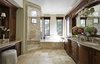 Modern home with Bath Room, Stone Counter, Travertine Floor, Undermount Sink, Soaking Tub, Recessed Lighting, Enclosed Shower, Accent Lighting, Stone Tile Wall, Mosaic Tile Wall, Wall Lighting, and One Piece Toilet. Master Bath remodel Photo 10 of Rustic elegance