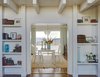 Modern home with Dining Room, Table, Chair, Medium Hardwood Floor, Pendant Lighting, and Shelves. Music Room and Dining Photo 3 of Stunning Beach House