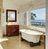 Modern home with Bath Room, Quartzite Counter, Ceramic Tile Floor, Freestanding Tub, Drop In Sink, Pendant Lighting, Open Shower, Recessed Lighting, Stone Tile Wall, and Glass Tile Wall. Master Bath Photo 5 of Stunning Beach House