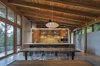 Modern home with Kitchen, Wood Cabinet, Ceramic Tile Backsplashe, Concrete Floor, and Ceiling Lighting. Kitchen Photo 3 of Brightwood Cabin