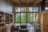Modern home with Living Room, Ceiling Lighting, Concrete Floor, Chair, and Two-Sided Fireplace. Library Photo 5 of Brightwood Cabin