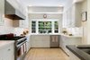 Modern home with Kitchen, White Cabinet, Medium Hardwood Floor, Granite Counter, and Subway Tile Backsplashe. John Viener House - Kitchen Photo 7 of John Viener Home