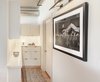 Modern home with Storage Room, Cabinet Storage Type, and Shelves Storage Type. A Kurt Cobain photograph hangs on the wall to remind guests where they are, and lest they forget, the Space Needle is right outside the windows, seen front and center from the bed or sofa. Photo 11 of Emerald City Studio