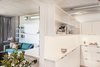 Modern home with Storage Room, Shelves Storage Type, and Cabinet Storage Type. We added a new wall, flanked with custom cabinetry, toward the side of the space. Photo 8 of Emerald City Studio
