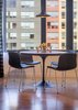 Modern home with Dining Room, Chair, Medium Hardwood Floor, Table, Ceiling Lighting, and Light Hardwood Floor. The round dining table is perfect for a meal as well as for hosting business meetings. Photo 14 of Emerald City Studio