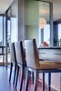 Modern home with Dining Room, Stools, and Ceiling Lighting. Stools from A.Rudin sit at the kitchen island. Photo 20 of Downsize Upstyle