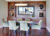 Modern home with Dining Room, Chair, Table, and Storage. In the dining room, we designed new custom cabinetry with contractor Solid Vision Interiors, to provide the Drinkards with plenty of storage and display space. Pieces in the art niches are Asian antiques from Glenn Richards in Seattle. Custom mirror from Museum Quality Framing perfectly reflects the city view. Pendant light from Hubbardton Forge; dining table from Michael Trayler; chairs from A. Rudin upholstered in Summer Hill fabric. Photo 19 of Downsize Upstyle
