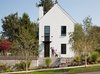 Modern home with Front Yard, Trees, Grass, Walkways, Hardscapes, Shrubs, Gardens, Wood Fences, Wall, Metal Fences, Wall, Exterior, House Building Type, and Wood Siding Material. The ToDD Residence Photo of The ToDD Residence