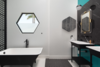 Modern home with Bath Room, Ceramic Tile Floor, Pedestal Sink, and Freestanding Tub. A Zucchetti Kos Italian imported tub serves as an anchor piece in the master bath. Zucchetti vanities and fixtures along with creative color-block Hexagon pattern floor tiles, Flos String Lights designed by Michael Anastassiades, and a custom hex Fleetwood window present a clean and streamlined feel and the ultimate of bespoke design expression. Photo 10 of 1980s Modern Meets The New Millennium