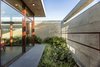 Modern home with Outdoor, Shrubs, and Grass. Outdoor space getting in nature yet securing the house. Photo 2 of The Open house
