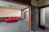 Modern home with Bedroom, Bed, and Ceiling Lighting. Interior view of the bedroom. Photo 8 of The Open house