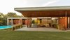 Modern home with Outdoor, Front Yard, Shrubs, Swimming Pools, Tubs, Shower, Grass, and Concrete Patio, Porch, Deck. Front view with the pool. Photo 7 of The Open house