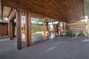 Living and dining areas viewed from the connected deep verandah. Photo 9 of The Open house modern home
