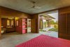 Modern home with Bedroom, Dresser, Wardrobe, Bed, Ceiling Lighting, and Shelves. View of internal and external spaces from the interior of the house. Photo 13 of The Open house