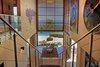 Modern home with Staircase, Wood Tread, and Metal Railing. Staircase with breeze way in front Photo of Pacific Breeze house overlooking the Ocean