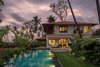 Modern home with Outdoor, Trees, Grass, Shrubs, Vegetables, Garden, Flowers, Walkways, Decking Patio, Porch, Deck, Small Pools, Tubs, Shower, Swimming Pools, Tubs, Shower, Landscape Lighting, and Small Patio, Porch, Deck. Tile-Bharat Floorings Group
Furniture- Boa Casa
Lighting- Deepam
Lighting- The Purple Turtles
Photo 2 of VILLA AT ASSAGAO