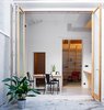 Modern home with Dining Room, Chair, and Table. view from patio inside the home Photo 8 of Can Ghalili