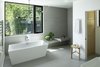 Modern home with Bath Room, Porcelain Tile Floor, Vessel Sink, Quartzite Counter, Ceiling Lighting, Recessed Lighting, Open Shower, Porcelain Tile Wall, and Freestanding Tub. Master Bathroom Photo 13 of Riverwood