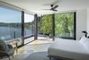Modern home with Bedroom, Bed, Night Stands, Recessed Lighting, Ceiling Lighting, and Light Hardwood Floor. Master Bedroom Photo 15 of Riverwood