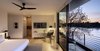 Modern home with Bedroom, Recessed Lighting, Bed, Light Hardwood Floor, Storage, Floor Lighting, Concrete Floor, Night Stands, Table Lighting, and Ceiling Lighting. Master Bedroom Photo 12 of Riverwood