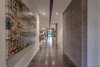 Modern home with Hallway, Concrete Floor, and Light Hardwood Floor. The central structural beam organizes the main circulation spine of the home. This main pathway
through the home is also defined by the exposed concrete flooring. Photo 3 of Arroyo House