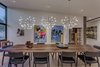 Modern home with Dining Room, Chair, Table, Recessed Lighting, Light Hardwood Floor, and Pendant Lighting. A custom Danish dining room table and elegant light fixtures help define the formal dining room just off the main living and kitchen space. Photo 4 of Arroyo House