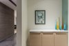 Modern home with Storage Room and Cabinet Storage Type. Artwork is used to highlight the foyer that leads into the master bedroom. Photo 7 of Arroyo House
