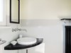 Modern home with Bath Room, Concrete Floor, Wall Mount Sink, Undermount Tub, Corner Shower, Wall Lighting, Wood Counter, and One Piece Toilet. Bathroom in 1920s style Photo 8 of Taut´s Home (Tautes Heim) - Rentable museum of design and architecture of the 1920s