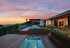 Modern home with Back Yard, Walkways, Hardscapes, Trees, Swimming Pools, Tubs, Shower, Large Pools, Tubs, Shower, Decking Patio, Porch, Deck, Wood Patio, Porch, Deck, Stone Patio, Porch, Deck, Tile Patio, Porch, Deck, Concrete Patio, Porch, Deck, Exterior, House Building Type, Wood Siding Material, and Green Roof Material. Sitting on top of Beverly Hills, the Trousdale Place Residence redefines contemporary design with a fresh sophisticated aesthetic. Photo of Trousdale Place Residence