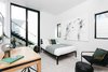 Modern home with Lamps, Recessed Lighting, and Chair. Floor-to-ceiling glass door connects the guest room to the pool area. Photo 11 of Milwood Residence